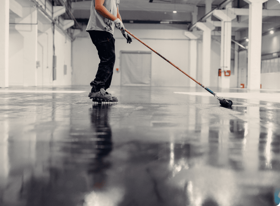 worker applying black epoxy resin in a big open em 2024 02 02 14 37 12 utc 1 (1)